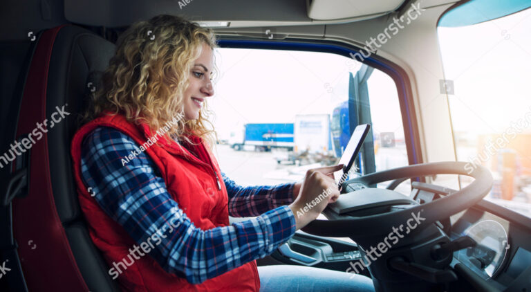 stock photo woman in truck on tablet