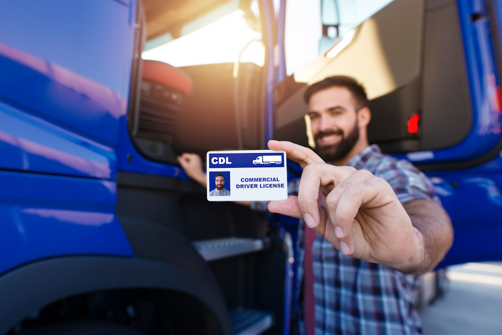 man holding his commercial drivers license