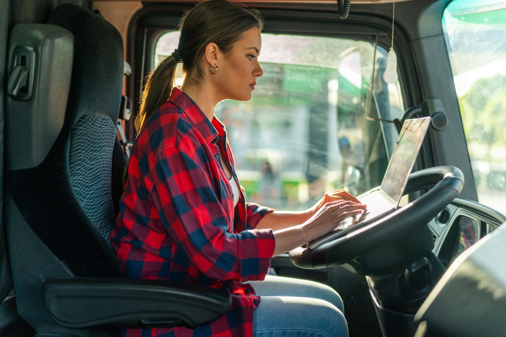 woman on laptop in truck